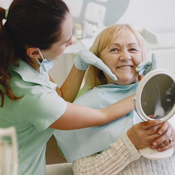 ninth east dental provo ut services cosmetic bonding Senior woman having dental treatment at dentist's office. Woman is being treated for teeth at ninth east dental